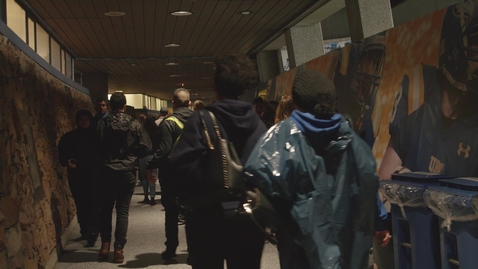 Thumbnail for Fans passing by inside Sports Arena Corridor