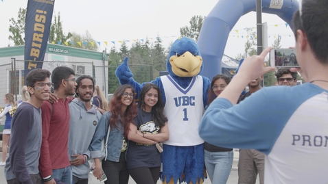 Thumbnail for Homecoming Fans posing for the camera outside the stadium