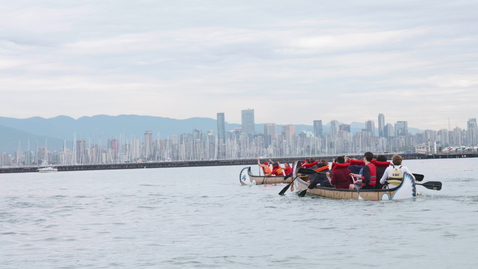 Thumbnail for Two Longboats race each other before downtown Vancouver backdrop