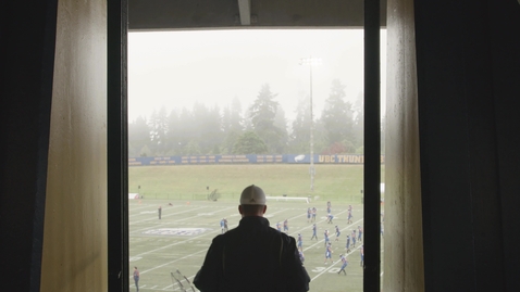 Thumbnail for Football Trainer walking out towards the football field