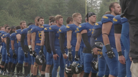 Thumbnail for Football Players in a line to salute opening Canadian anthem