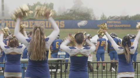 Thumbnail for Cheerleader Squad performing in front of Football Field